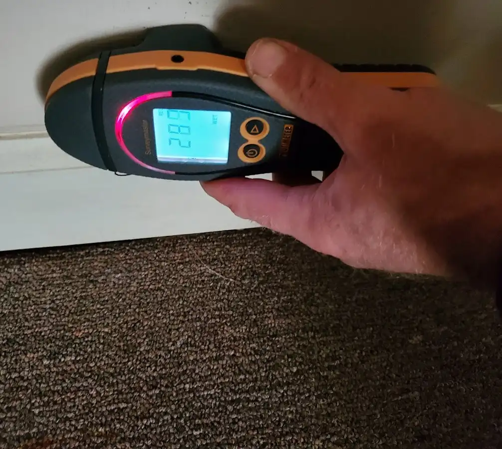 Moisture detection at baseboard during Burst Pipe Cleanup in Summerville